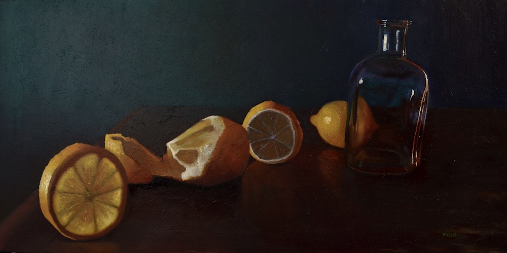 Citrus with candlelight falling oddly on jar
