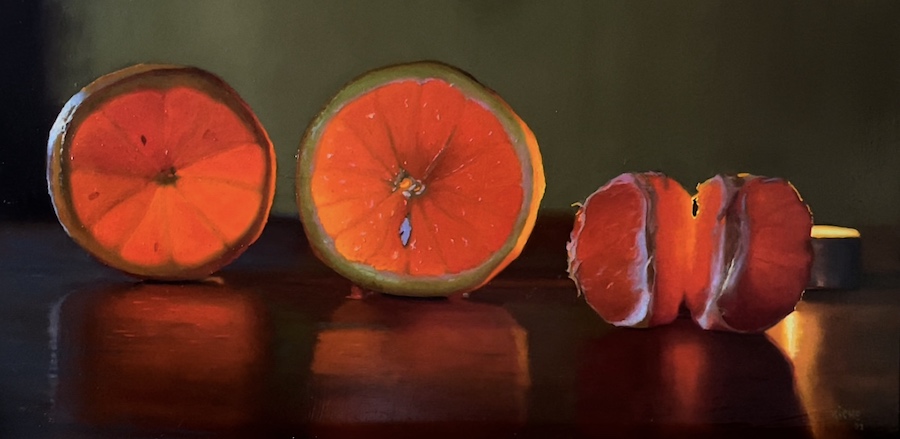 Orange cuties in candlelight
